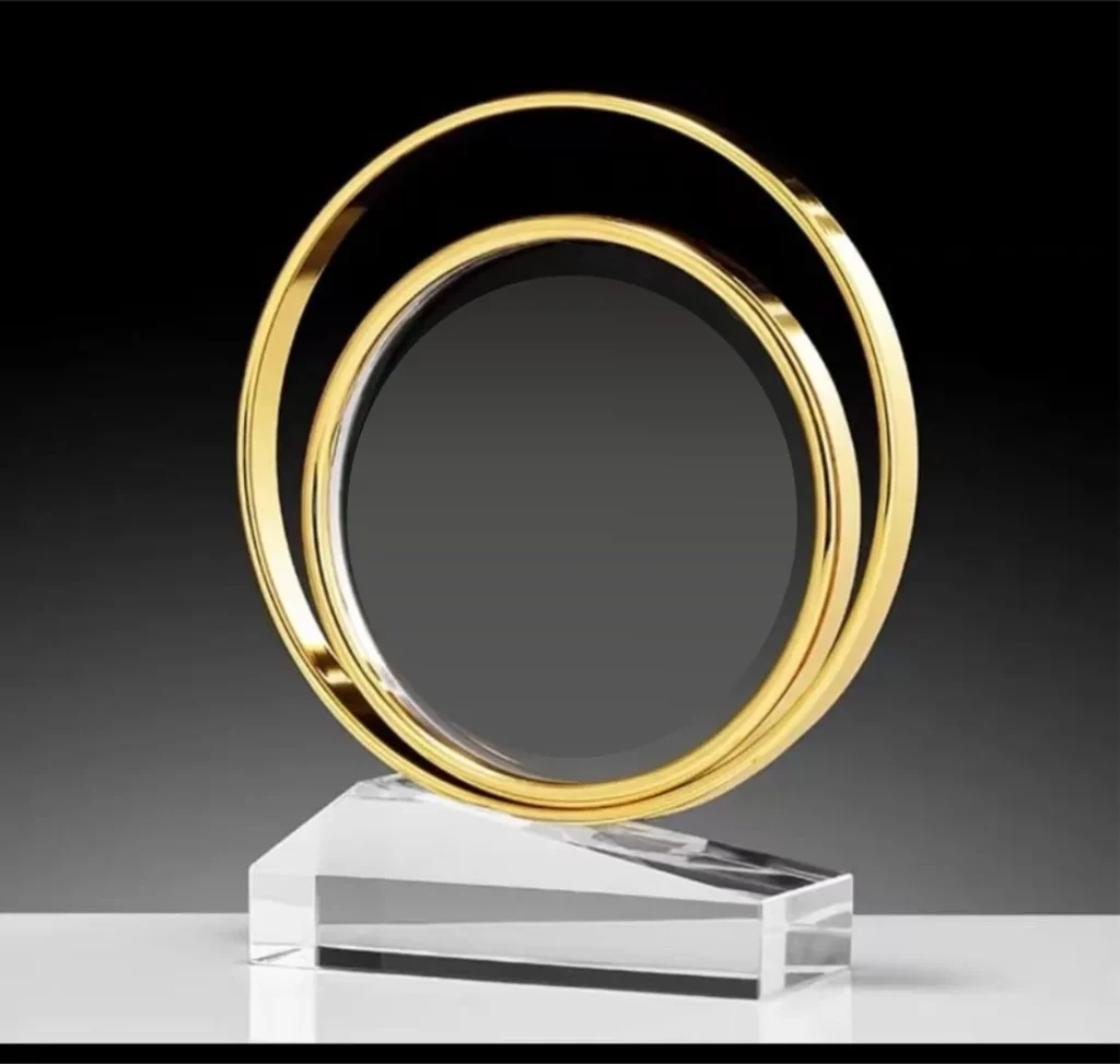 Premium circle trophy featuring a double-layer metal ring mounted on a clear acrylic base, designed as a modern corporate award for recognition, achievements, and custom engraving for events and ceremonies.